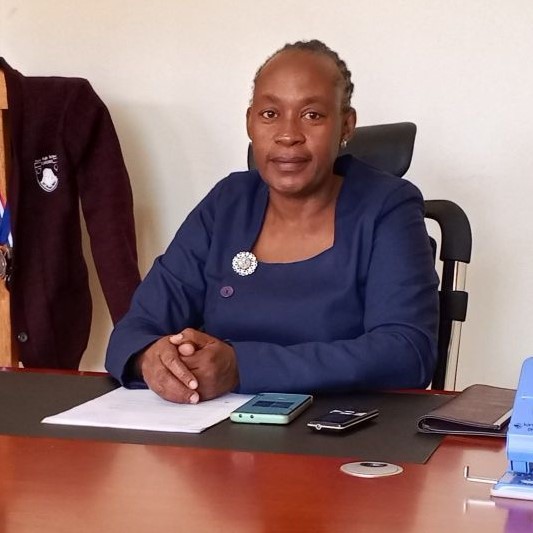 Madam Faith Okongo, Headteacher